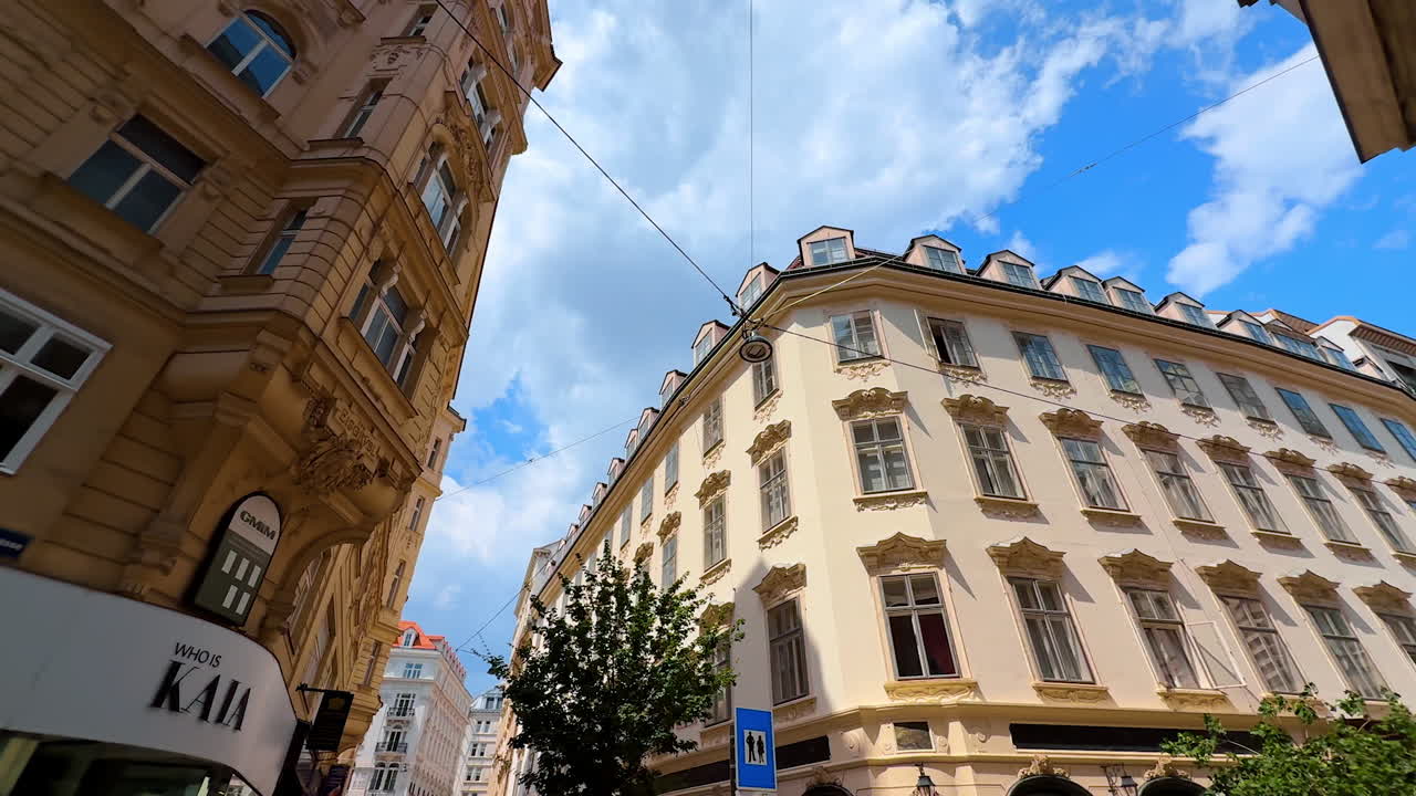 Vienna, Austria - June 9, 2025: Spectacular old buildings of historical part of Vienna, Austria. Low angle view at the facades along the street