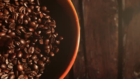 dropping coffee beans into a bowl