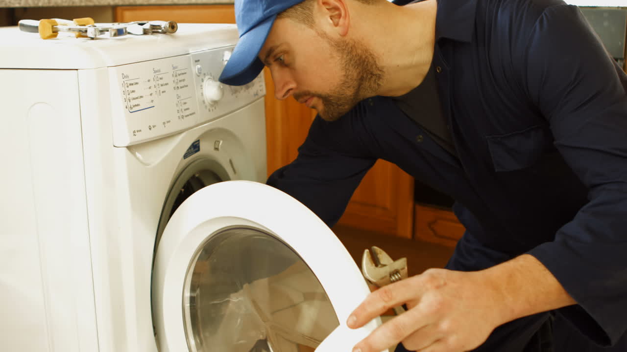 Man fixing the washing machine