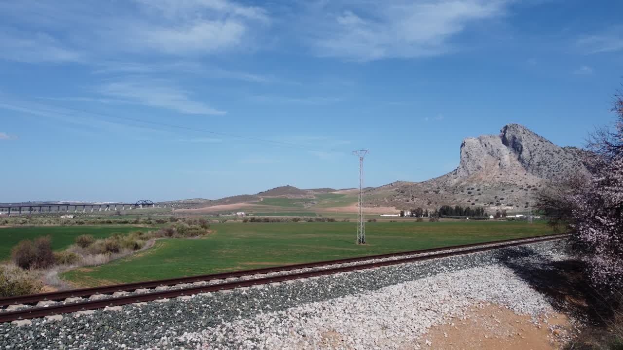 Spectacular aerial flight over the enclave of Pe&ntilde;a de los Enamorados, a rock formation in the shape of a human face in the municipality of Antequera in Andalusia, Spain