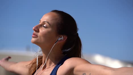 Relaxed-woman-with-closed-eyes-exercising-outdoor