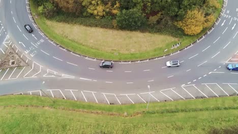roundabout roads junction fly over aerial view looking down at suburb neighbourhood