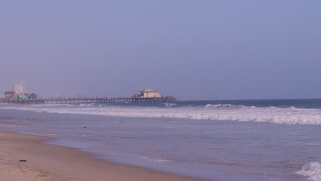 tilting down shot of santa monica pier on a bright and sunny day