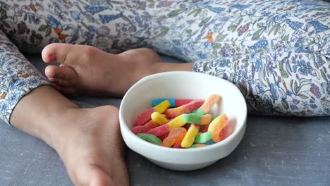 child with gummy worms