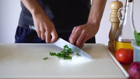 fresh spring onion sliced in white chopping board by sharp knife