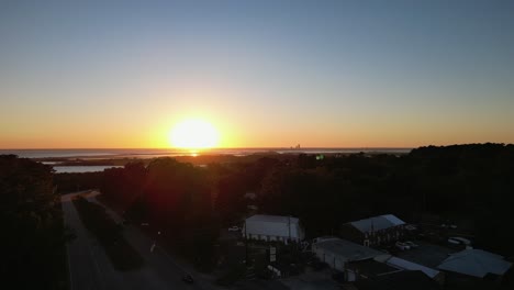 sunset over mobile bay near spanish fort, alabama