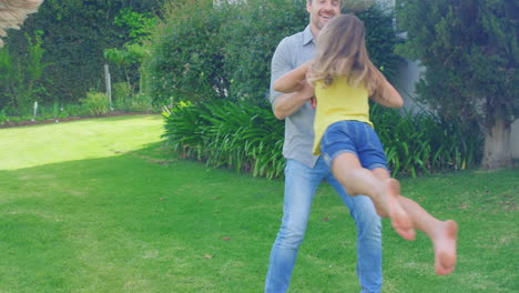 father and daughter having fun in the garden