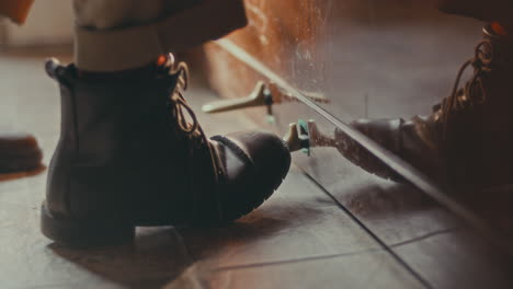 person's foot on a piano pedal