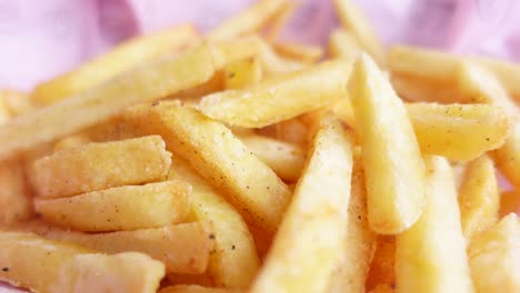 Child-eating-french-fries-on-table