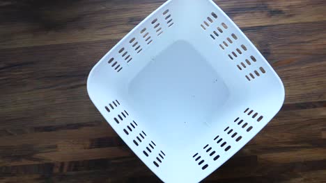 empty and full white plastic basket