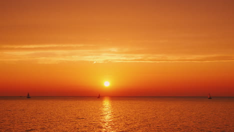 beautiful sunset over lake ontario in the usa yachts are visible in the distance