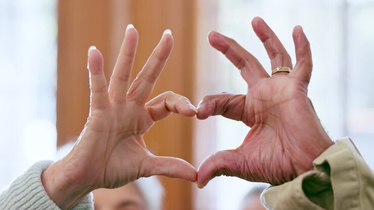 Heart, hands and senior couple with love