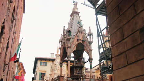 slow motion clip of a street in the centre of verona city, italy, with historical buildings and location all around
