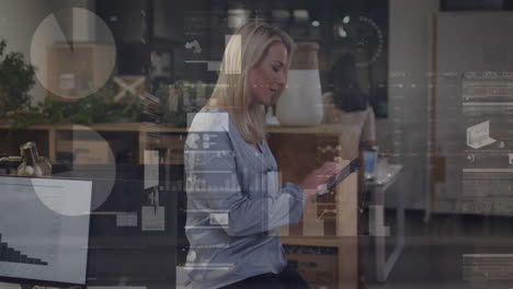 animation of statistical data processing over caucasian woman using tablet at office