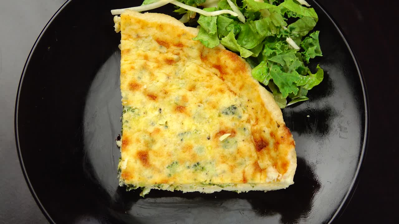 A savory broccoli quiche delight featuring fresh broccoli florets baked into a creamy egg filling creating a wholesome flavorful dish perfect for breakfast brunch or anytime enjoyment