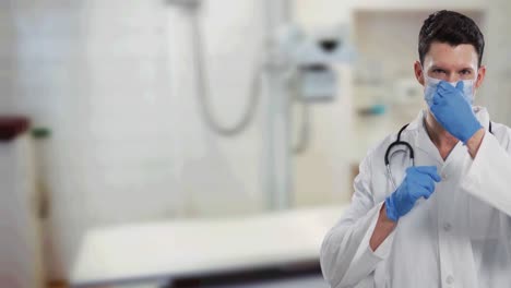 portrait of caucasian male doctor adjusting his face mask against hospital in background