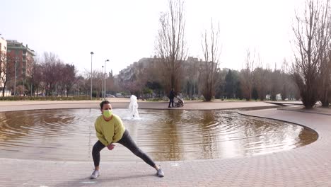 athlete woman doing stretching in park after running