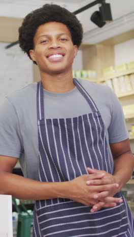 animation of happy biracial waiter at coffee shop