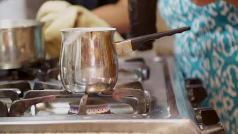 a pan with hot milk to mix with coffee