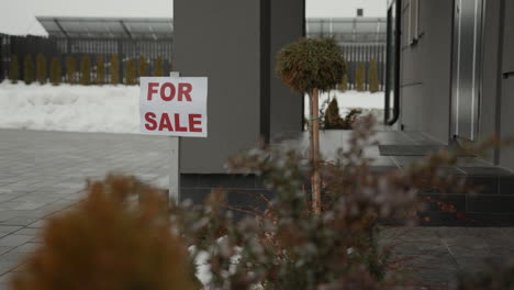 for sale banner on a house