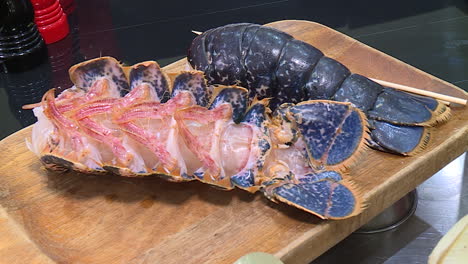 preparing a raw blue lobster