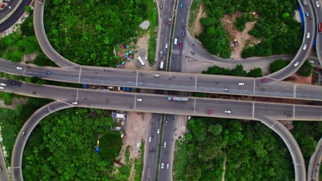 spectacular top down view of maduravoyal flower shaped bypass flyover with vehicles and greenery at kamaraj nagar, chennai bypass road, tamil nadu, india. day time, top down shot, drone shot, 4k.