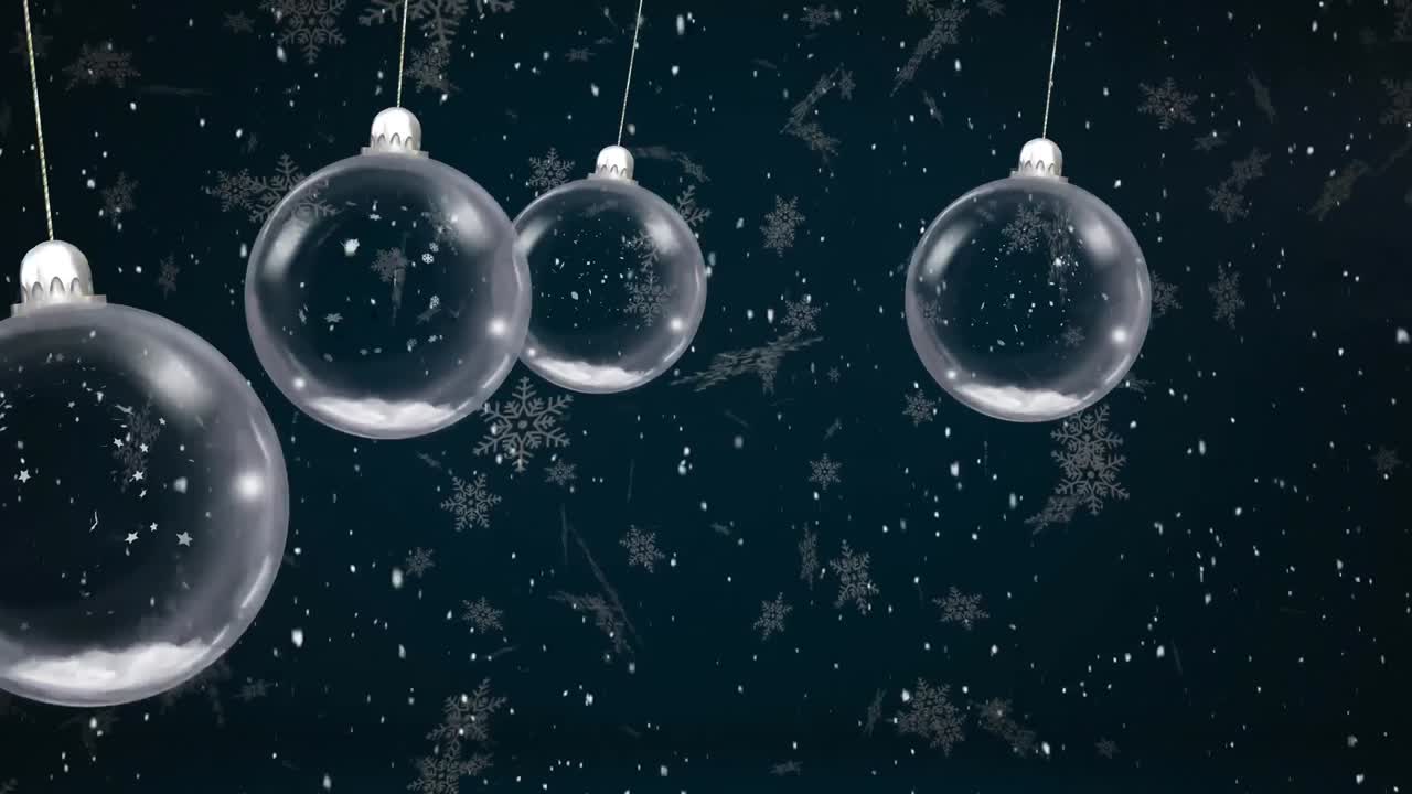Animazione di palline di Natale oscillanti su neve che cade su sfondo nero
