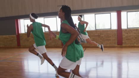 diverse female basketball team running and wearing sportswear