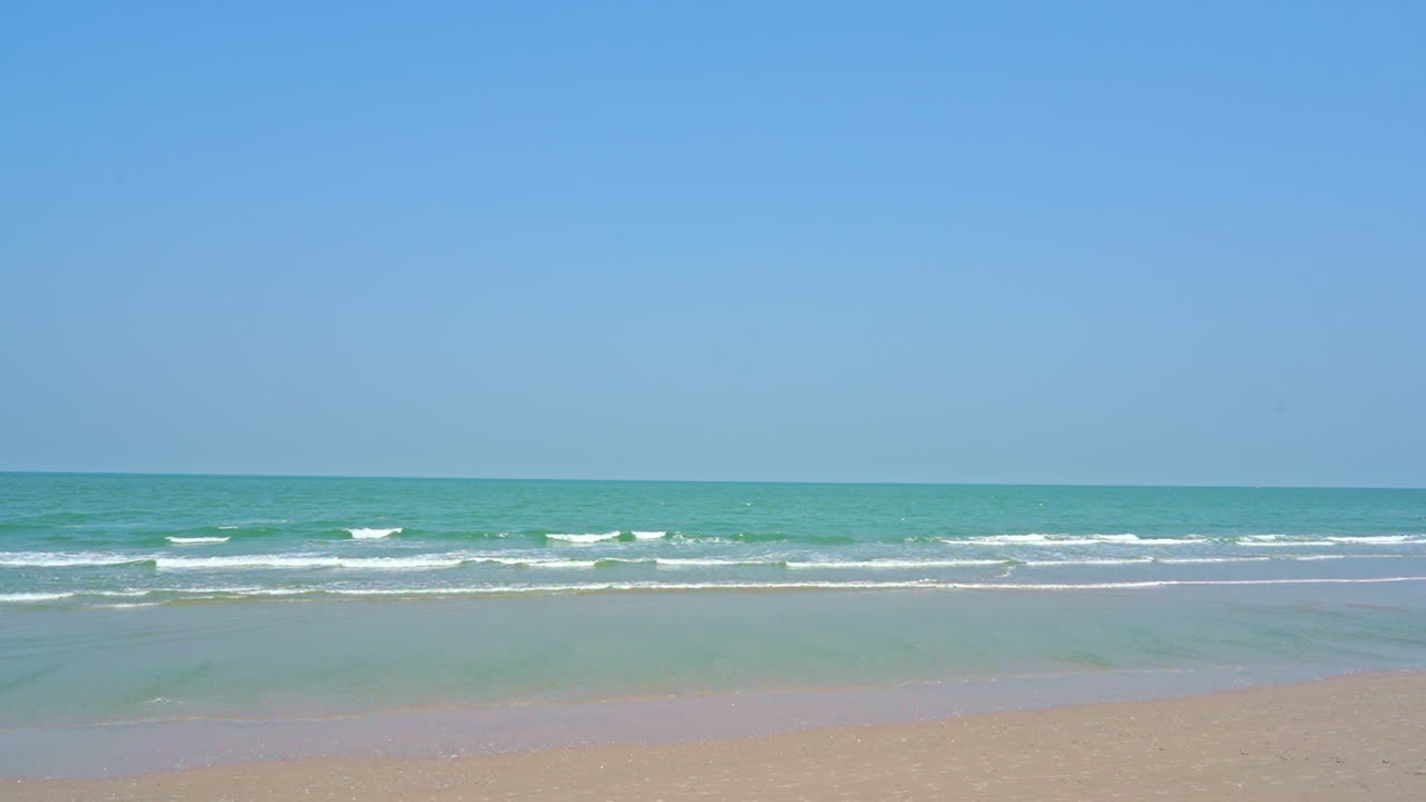 Seascape and Beach on Perfect Blue Sunny Day. Gentle Pan
