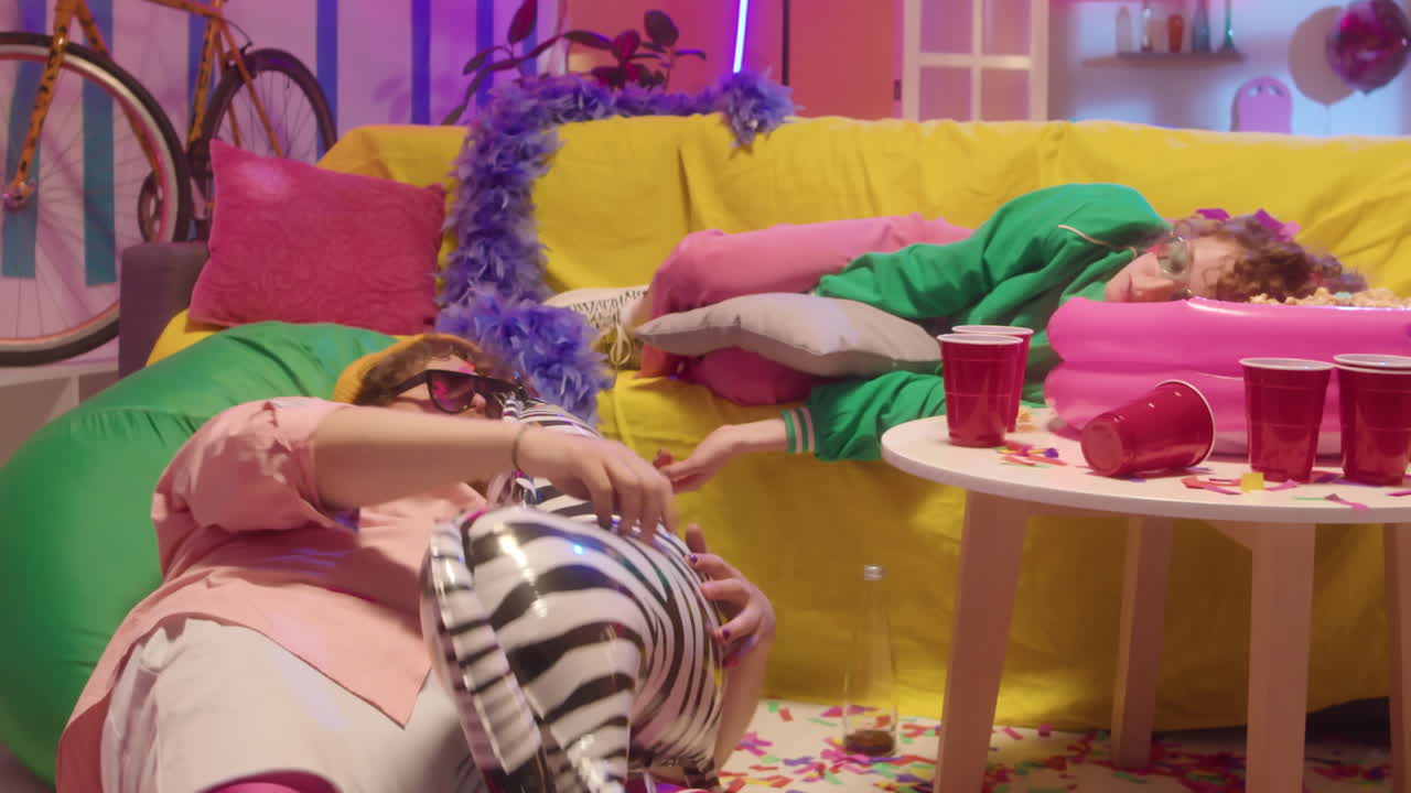 Drunk Partygoers Sleeping on the Couch