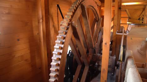 wooden gears turning inside a traditional mill