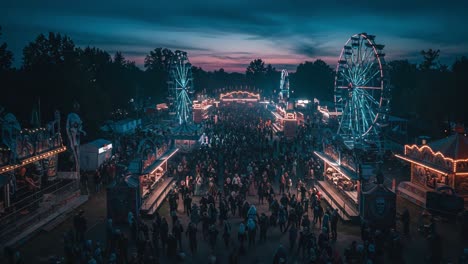 a lively night at the carnival: illuminated rides and crowds gather under a stunning twilight sky reshape a magical atmosphere in this vibrant festival scene