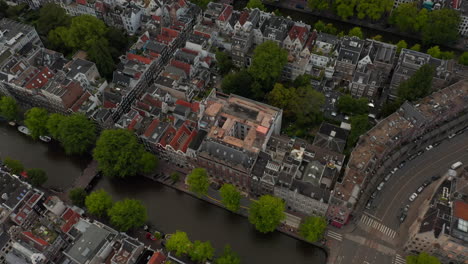 Birds-Eye-View-of-typical-Amsterdam,-Netherlands-Neighbourhood-with-Canals-and-Bridges