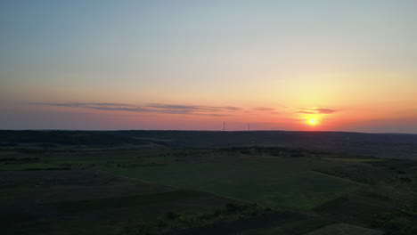 Pastel-Panorama:-A-Drone's-Expedition-Across-Countryside-Fields,-Drenched-in-the-Rosy-Blue-Hues-of-a-Sunset-Sky