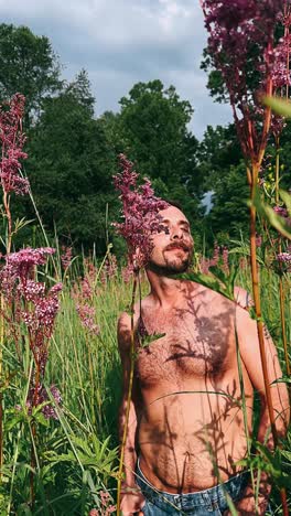 man in a field of purple flowers