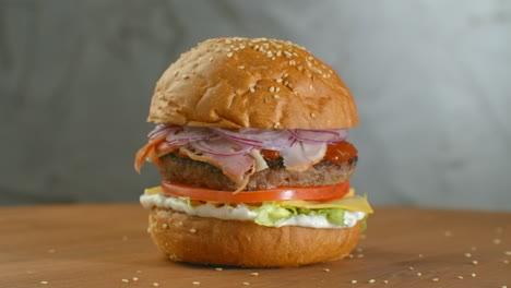 White-sesame-seed-falling-into-bun-in-slow-motion.-Bun-with-sesame-for-making-hamburger