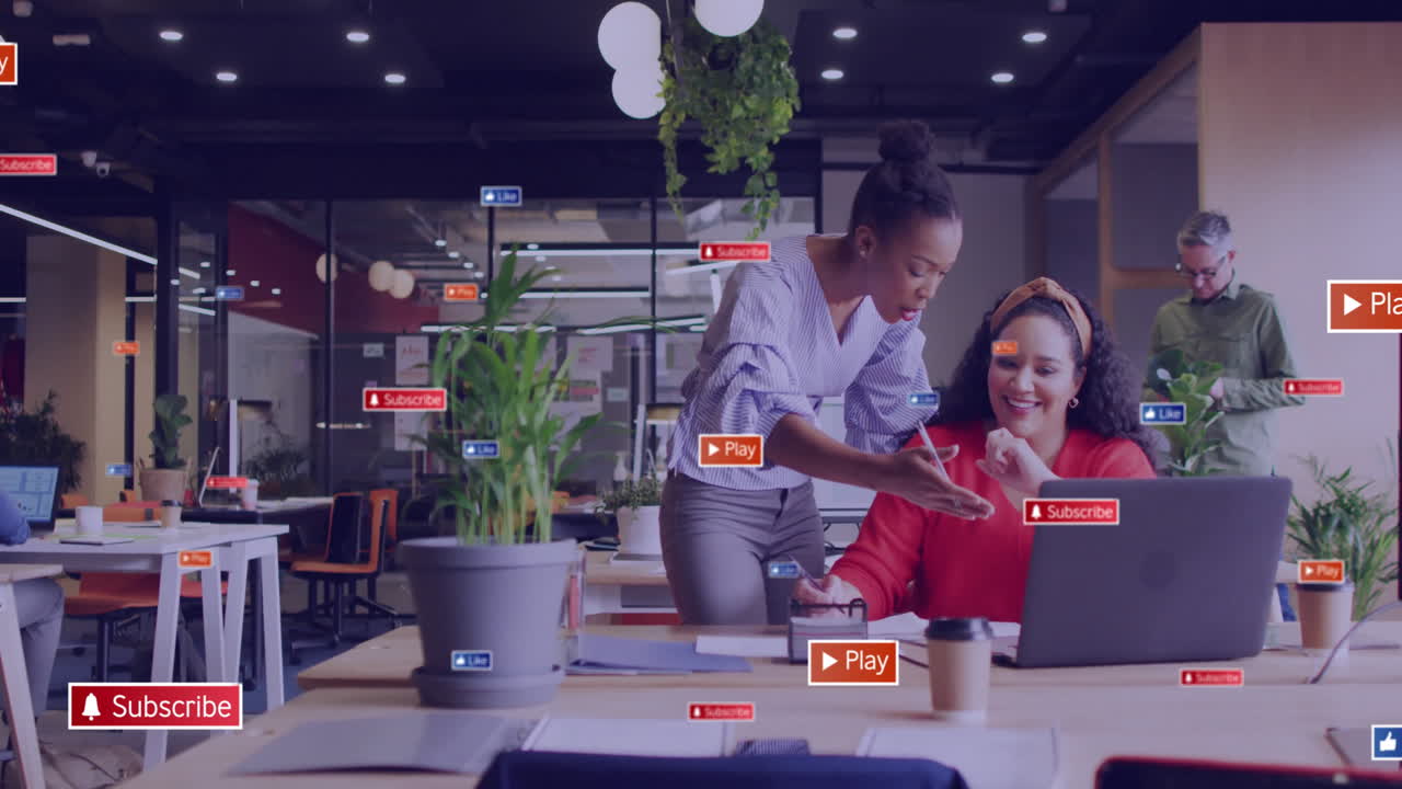 Animation of social media icons with texts over diverse colleagues discussing work in office