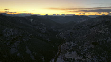 Colorado-Christmas-first-snow-frosted-Mount-Lindo-memorial-golden-sunset-Christian-Catholic-Jesus-Cross-hope-and-faith-285-highway-Morrison-Conifer-Evergreen-aerial-cinematic-drone-backward-pan-up