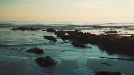 Waves-crushing-in-a-beach-shore-in-the-sunset