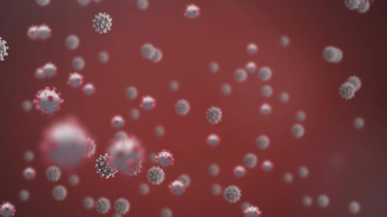 Animazione di cellule Covid-19 che fluttuano su sfondo rosso.