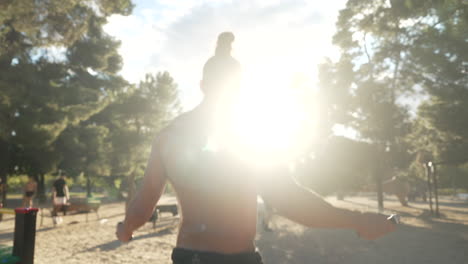 man skipping rope in a park
