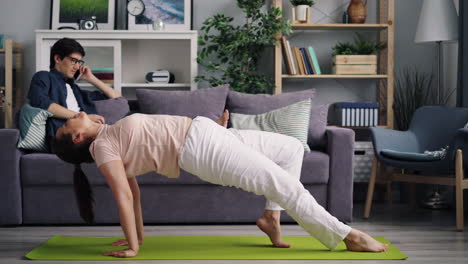 couple's home yoga session