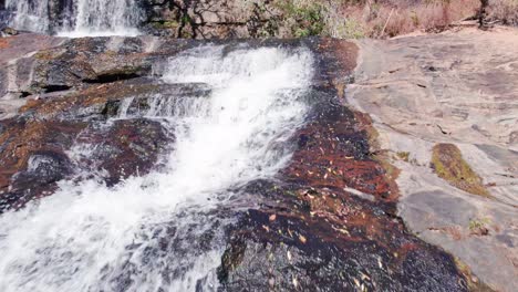 Backward-Revealing-aerial-shot-from-closeup-waterfall-to-wide-shot-showing-surprise-and-an-even-bigger-waterfall