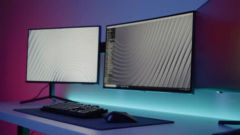 modern dual monitor gaming or workstation setup with rgb lighting