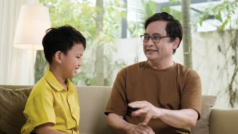 Asian-man-and-boy-in-the-living-room