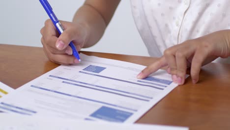 a person focuses signing important documents a professional office setting