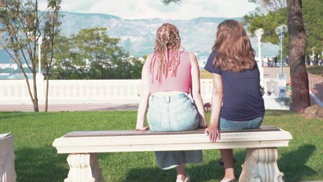 two friends enjoying a park view