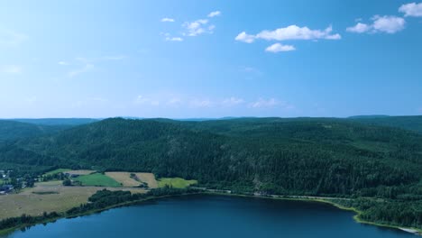 höga kusten skuleberget, drone push-in over trees and lake