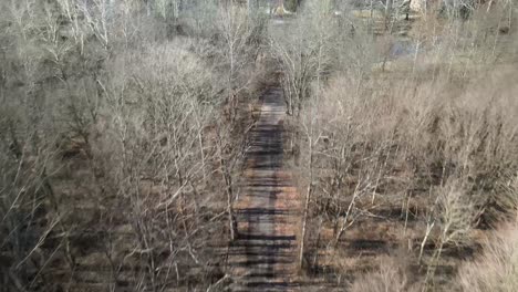 Aerial-footage-of-a-trail-that-leads-to-a-creek