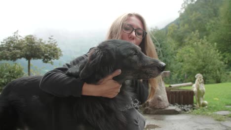 woman embraces her dog